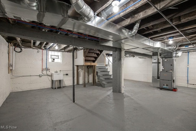 1360 E 114th St, Cleveland, OH 44106 - basement featuring stairway and heating unit