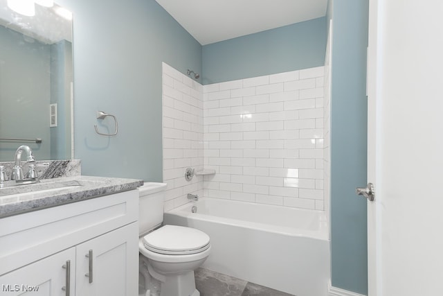 full bathroom with vanity, toilet, and tiled shower / bath