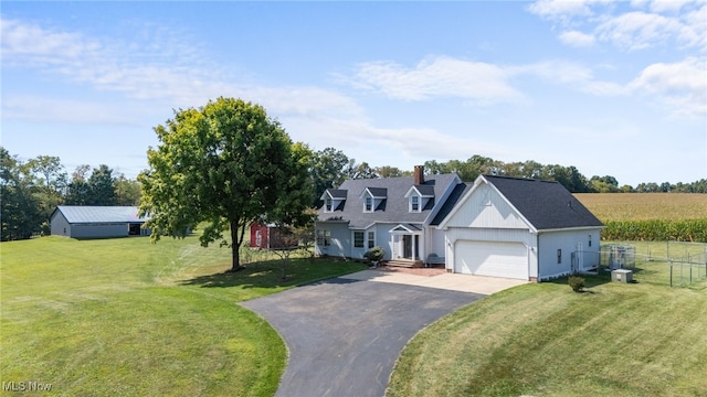 view of front of property with a front lawn and a garage