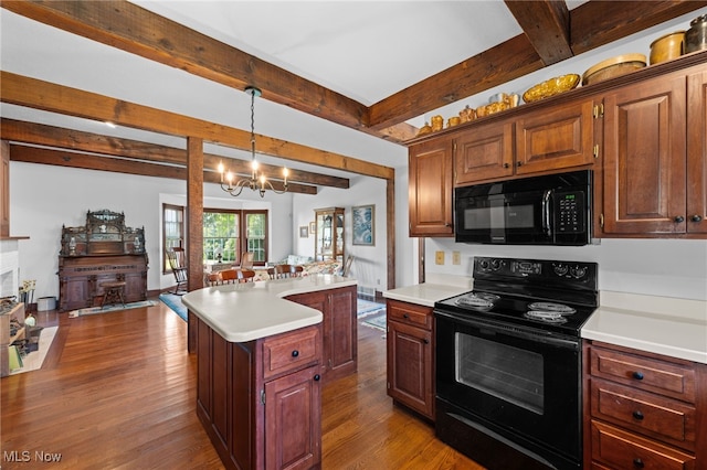 kitchen with wood-type flooring, black appliances, a center island, and a chandelier