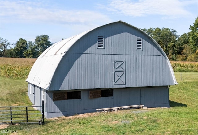 view of outbuilding with a lawn