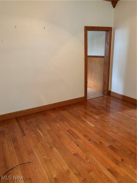 spare room with light hardwood / wood-style flooring