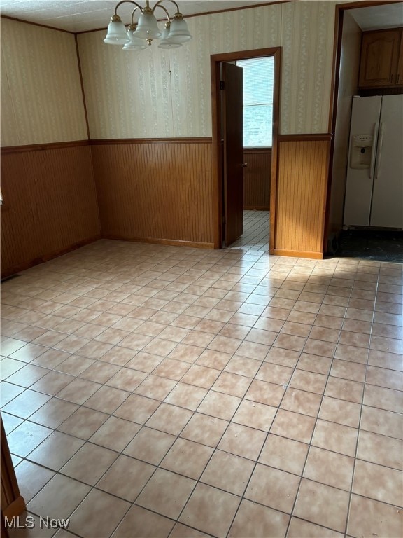 empty room with an inviting chandelier