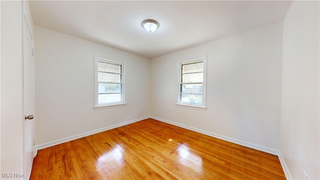 spare room featuring hardwood / wood-style floors