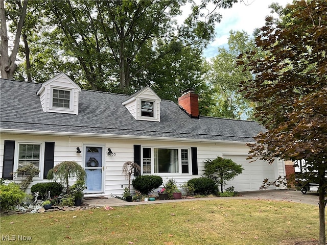 cape cod house with a front lawn and a garage