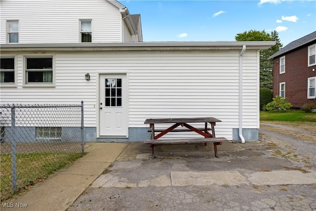 property entrance with fence