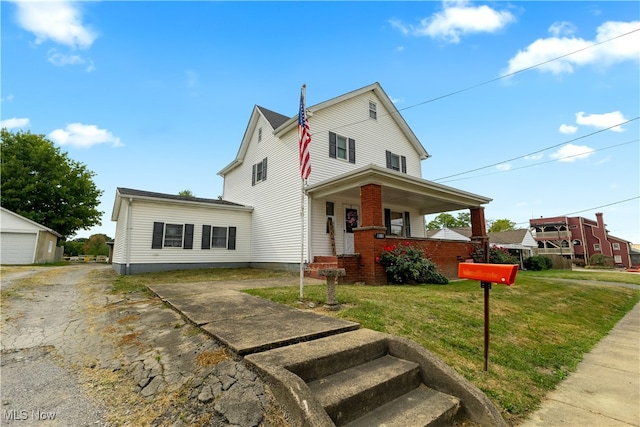 view of front of house with a garage and a front lawn