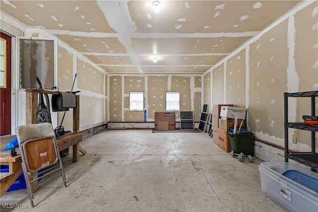 interior space featuring unfinished concrete flooring