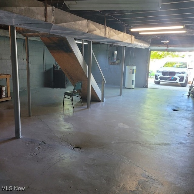 interior space featuring washer / clothes dryer, electric water heater, and electric panel