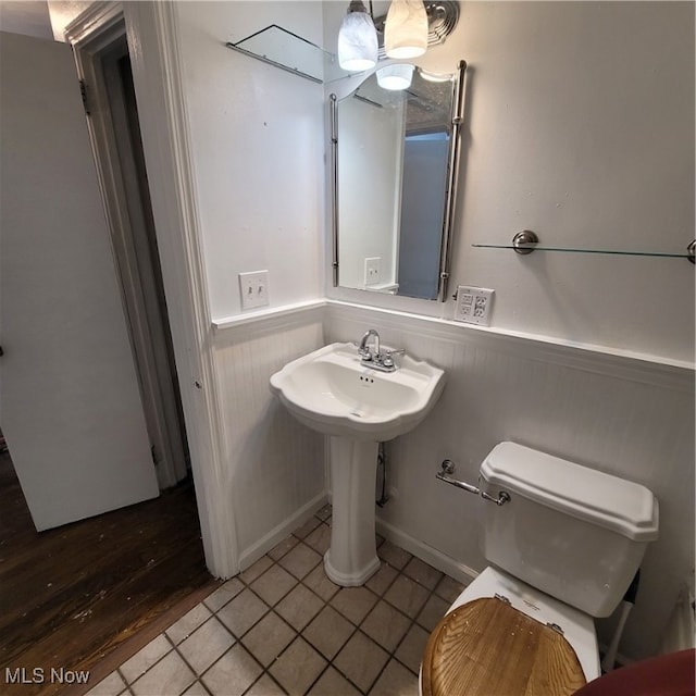 bathroom featuring toilet and hardwood / wood-style flooring