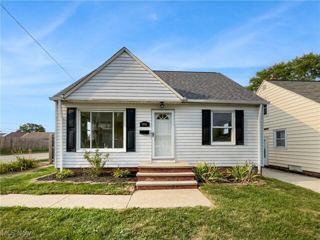 bungalow-style house with a front yard