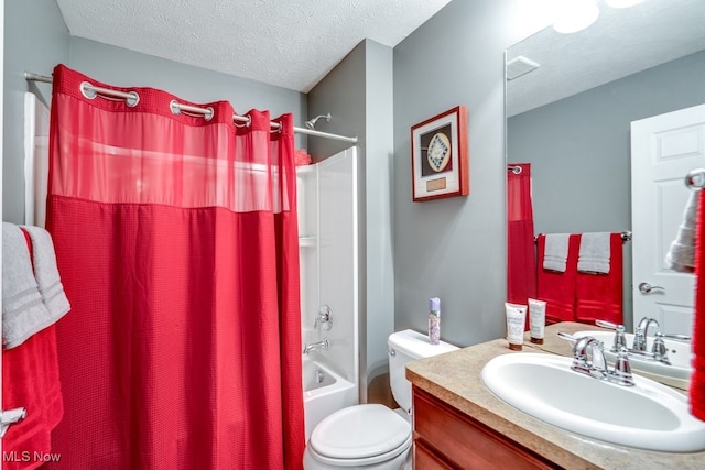 full bathroom featuring vanity, toilet, a textured ceiling, and shower / tub combo with curtain