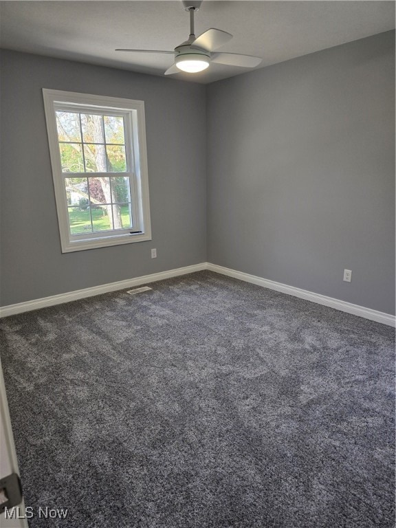 empty room featuring ceiling fan and carpet flooring