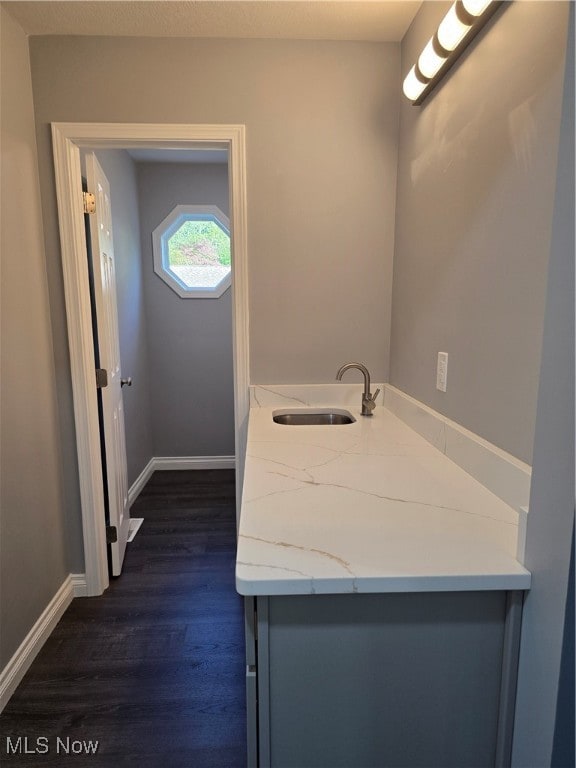 bathroom with vanity and hardwood / wood-style floors