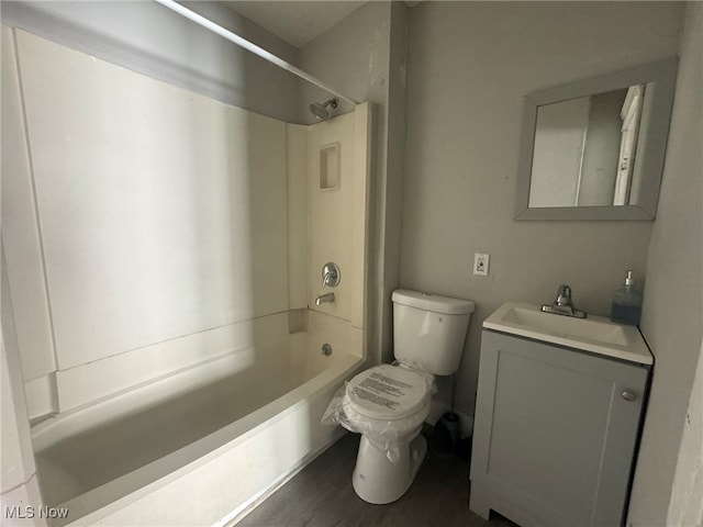 full bathroom with shower / tub combination, hardwood / wood-style flooring, vanity, and toilet