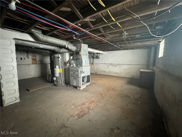 basement with heating unit and water heater