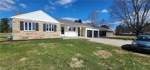 view of front facade with a front lawn and a garage