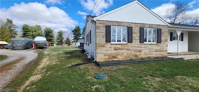 view of home's exterior with a yard