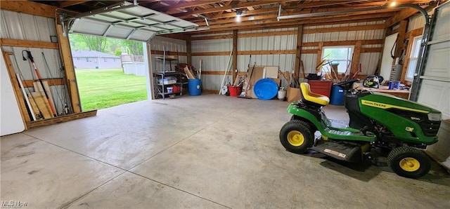 garage featuring a lawn