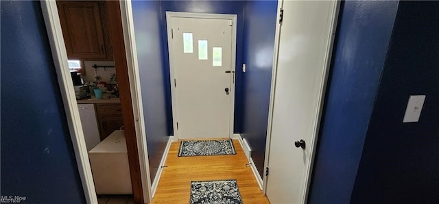 doorway to outside featuring light hardwood / wood-style flooring