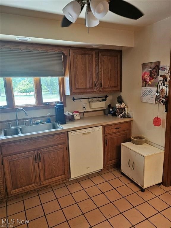 kitchen with ceiling fan, white dishwasher, sink, and light tile patterned flooring