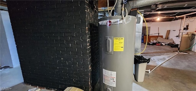 utility room featuring water heater