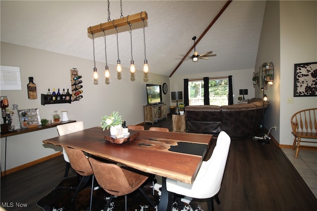 dining room featuring ceiling fan, hardwood / wood-style flooring, vaulted ceiling, and a textured ceiling