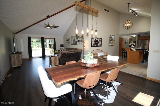 dining space featuring wood-type flooring, a textured ceiling, high vaulted ceiling, and ceiling fan