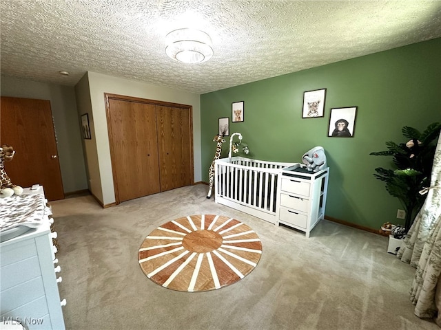 unfurnished bedroom with a textured ceiling, light carpet, and a closet