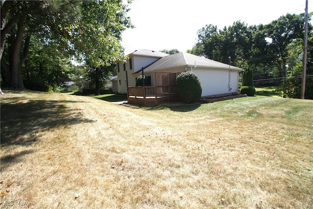 view of yard with a wooden deck