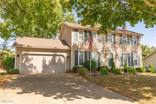 colonial house featuring a garage