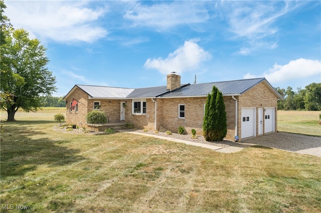 single story home with a garage and a front lawn