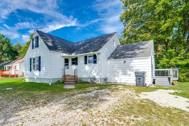 rear view of house with a lawn