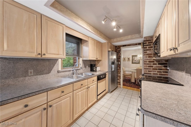 kitchen featuring light tile patterned flooring, appliances with stainless steel finishes, light brown cabinetry, sink, and decorative backsplash