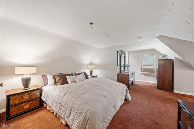 carpeted bedroom with vaulted ceiling