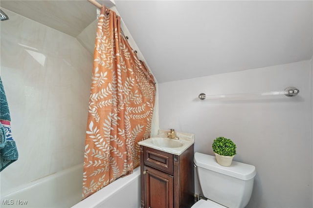 full bathroom featuring vanity, toilet, vaulted ceiling, and shower / bath combo