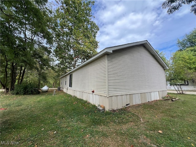 view of property exterior with a yard