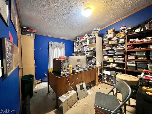 office space with a textured ceiling and ornamental molding