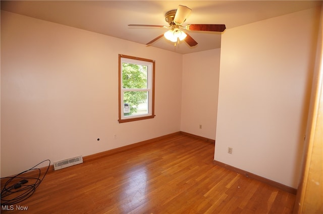 unfurnished room featuring wood-type flooring and ceiling fan