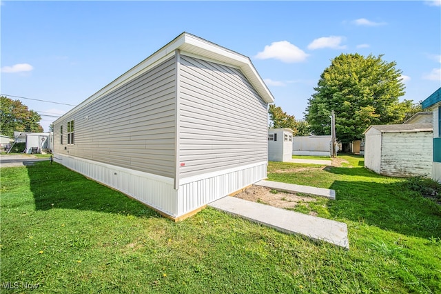 view of side of property with a lawn