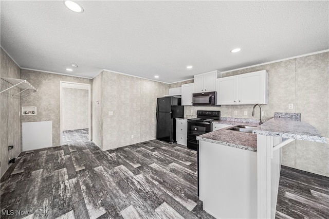 kitchen featuring white cabinets, sink, kitchen peninsula, black appliances, and dark hardwood / wood-style floors