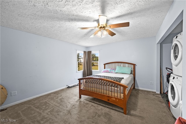 bedroom with a textured ceiling, stacked washer and dryer, ceiling fan, and dark carpet