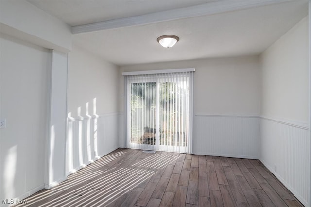 unfurnished room with dark hardwood / wood-style floors