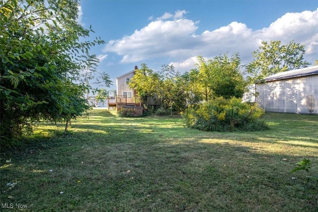 view of yard featuring a wooden deck