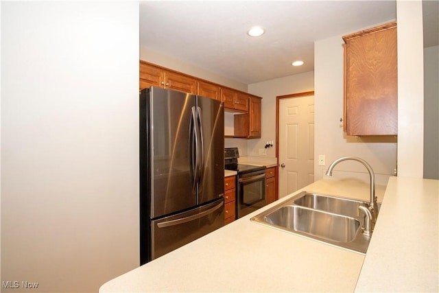 2452 Barrington Way Unit 430, Wooster, OH 44691 - kitchen with a sink, light countertops, brown cabinets, recessed lighting, and stainless steel appliances