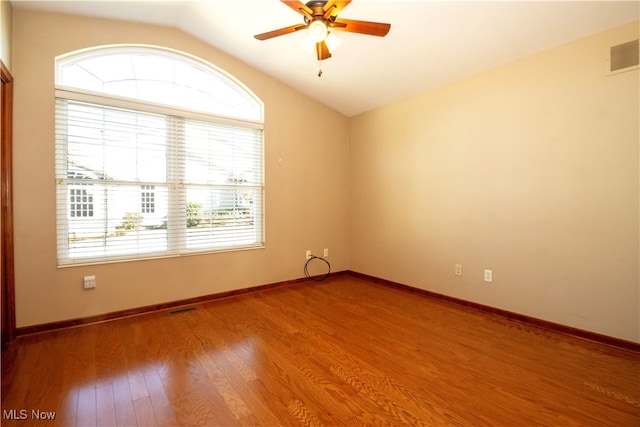 unfurnished room with vaulted ceiling, ceiling fan, and hardwood / wood-style flooring