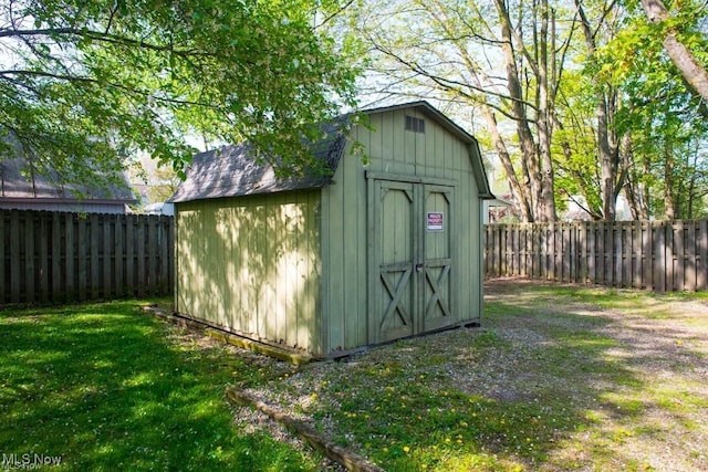 view of shed featuring a fenced backyard