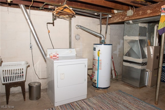 clothes washing area with washer / dryer and water heater