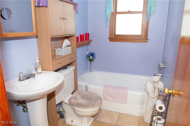 full bathroom featuring sink, toilet, washtub / shower combination, and tile patterned floors