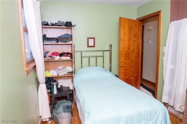 bedroom featuring hardwood / wood-style floors